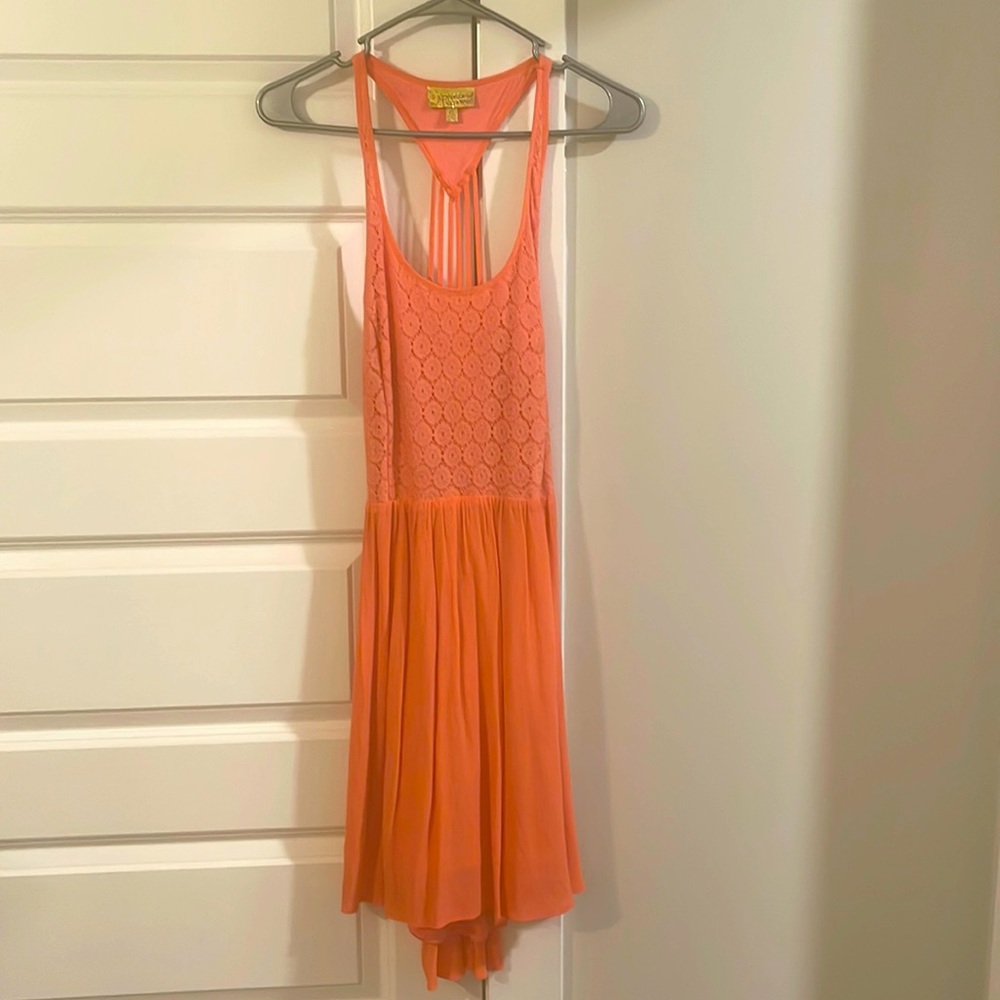 This beautiful pinkish orange backless dress is beautiful for any occasion